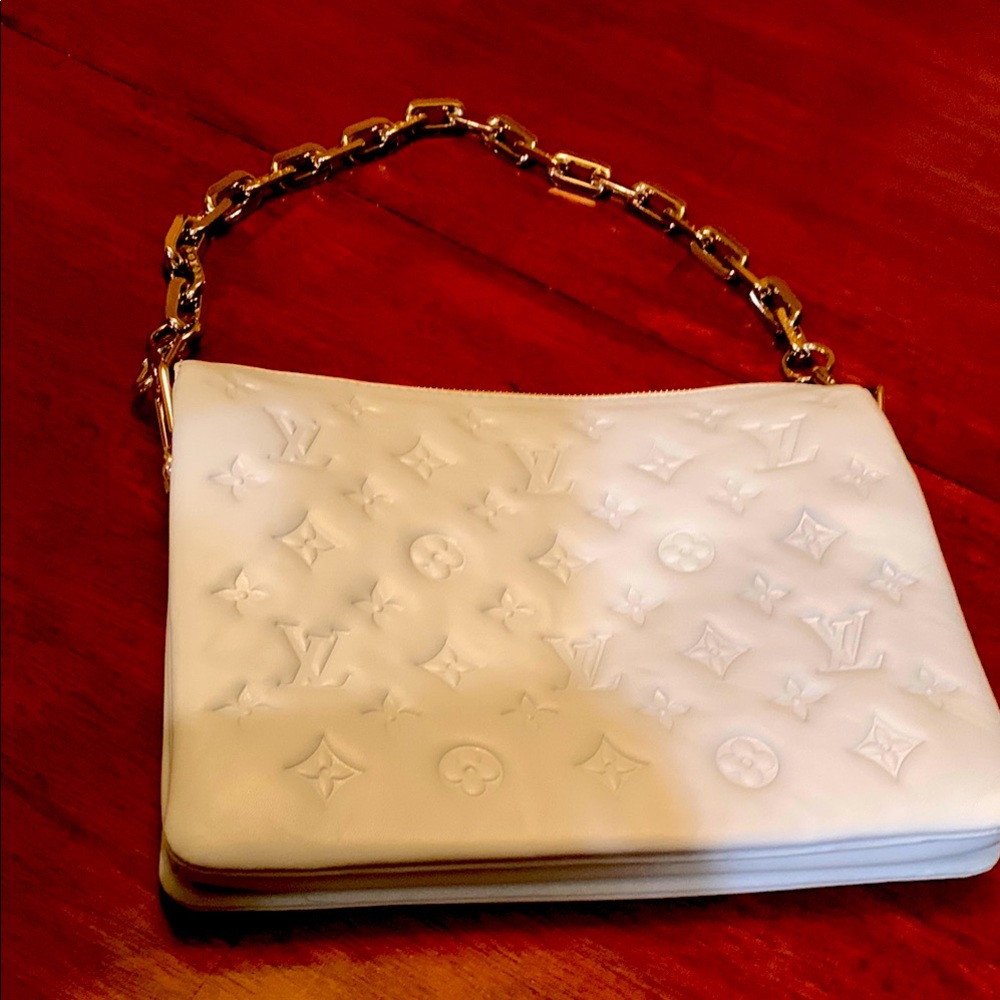 Authentic Brand new Louis Vuitton baby blue color Embossed Leather Chain purse.